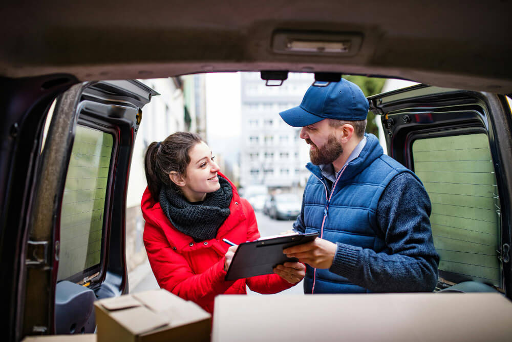 man and woman tolking to each other _ making delivery